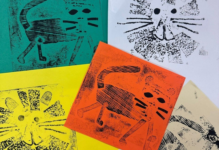 Collograph prints of big cats on colourful paper