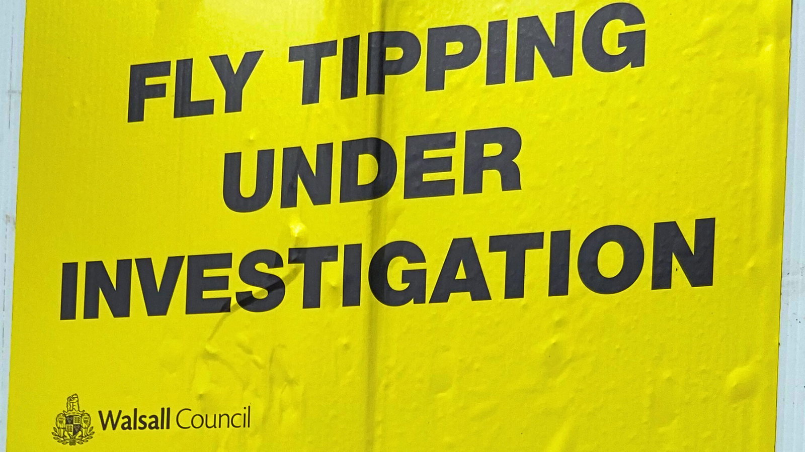 fly tipping under investigation yellow sign