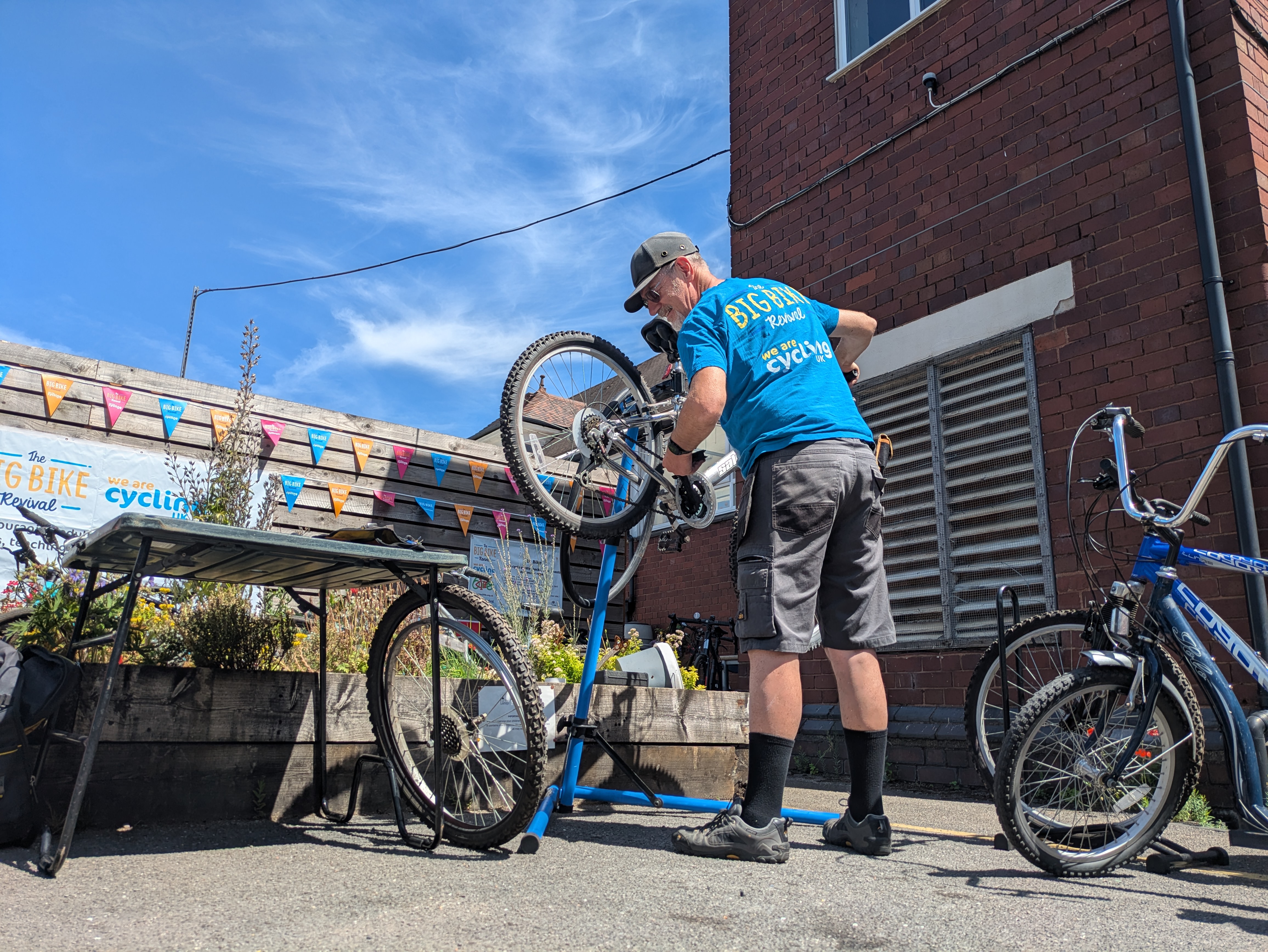 Dr. Bike performing safety checks and fixes