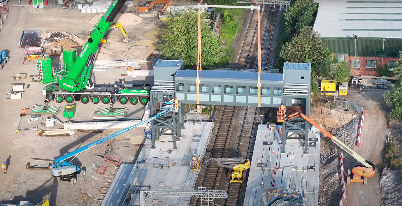 a station footbridge being craned onto site