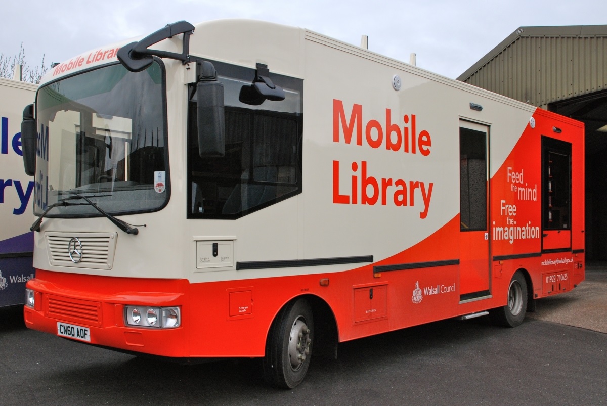 The white and orange Mobile Library Vehicle