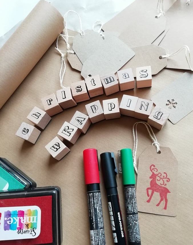 gift tags, paper and pens on a table