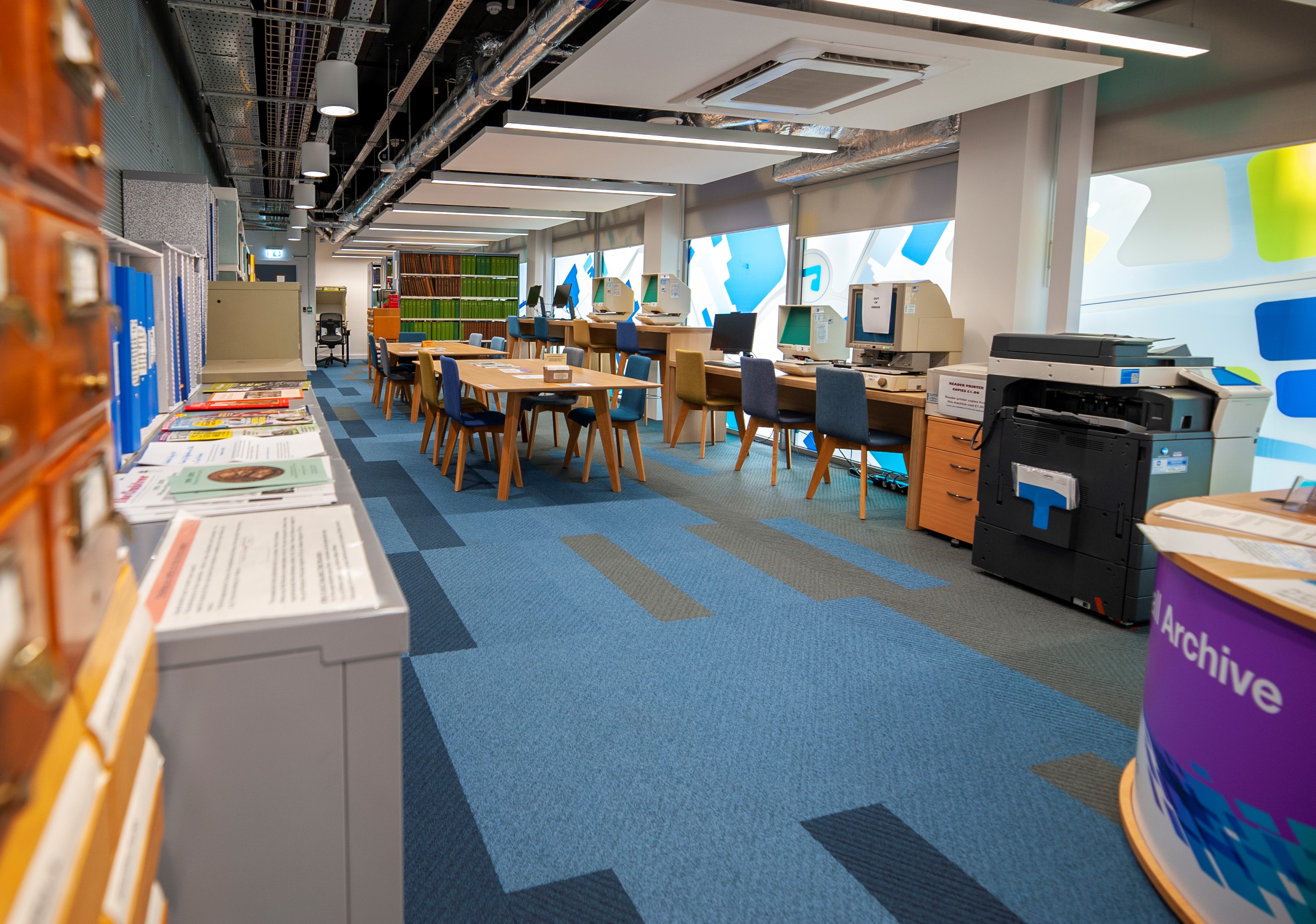 Research room at Walsall Archives, showing microfiche readers, computers and copying facilities