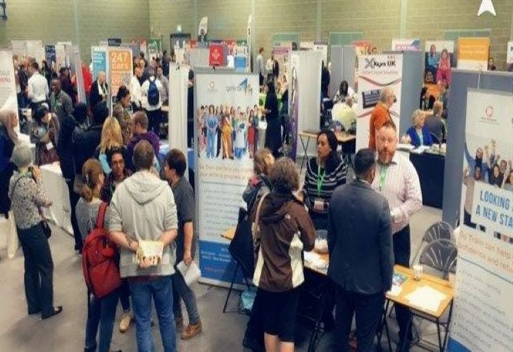 People gathering around job stalls