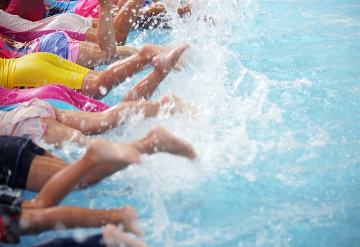 Swimmers splashing legs