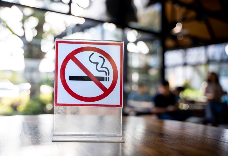 No smoking signage placed on a table.