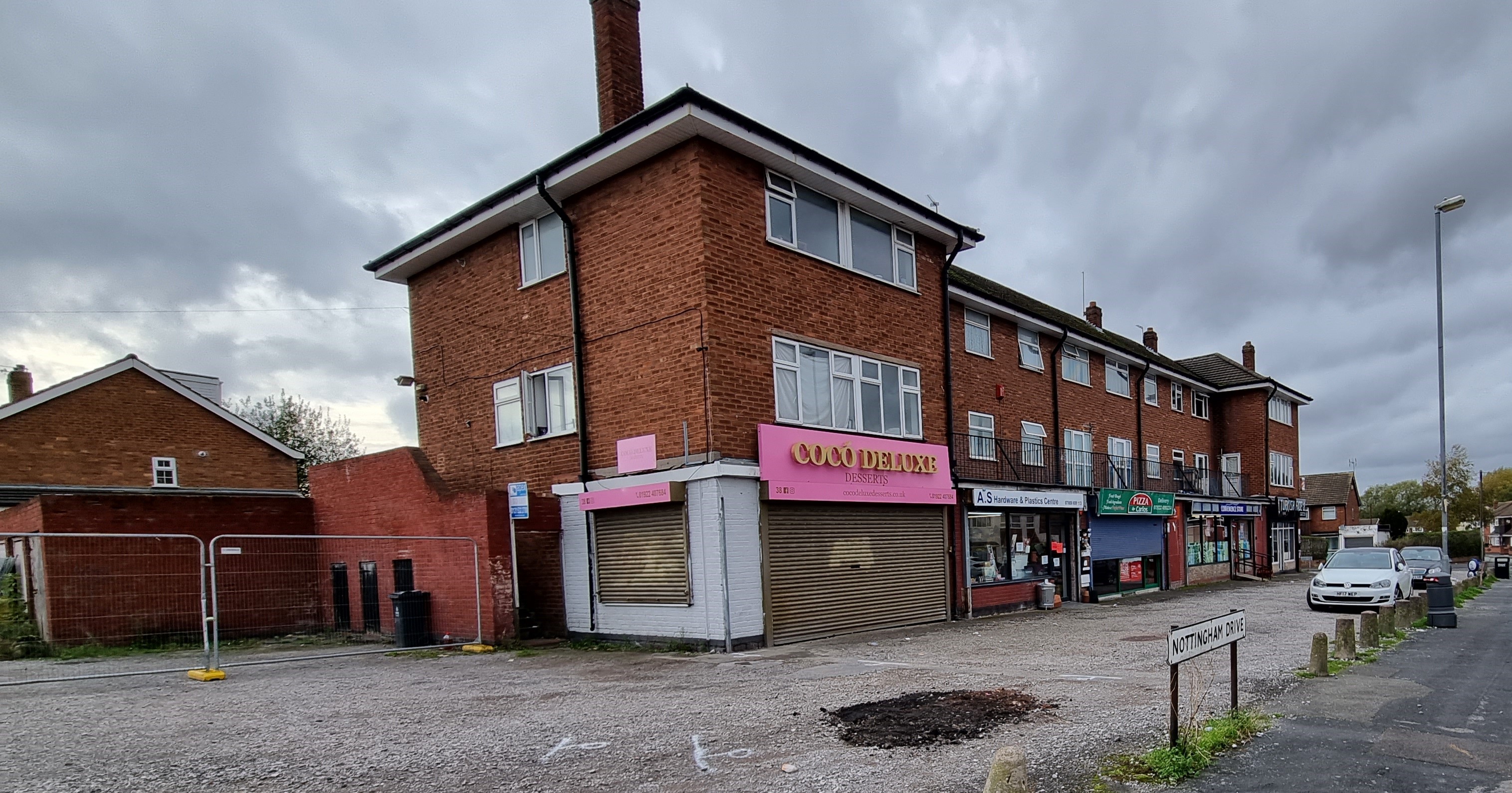 A photograph of the shopping area and car park on Nottingham Drive in Willenhall