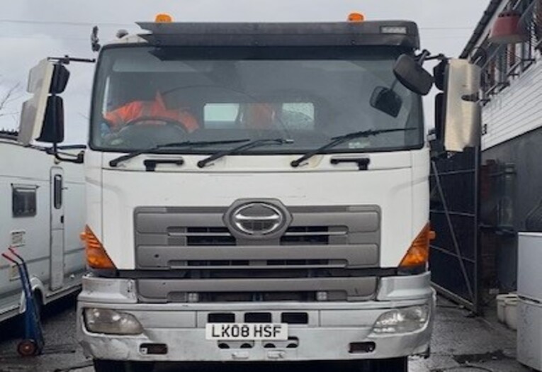 front of a white lorry