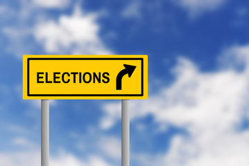 Road sign with the word "elections" and an arrow, against a blue sky