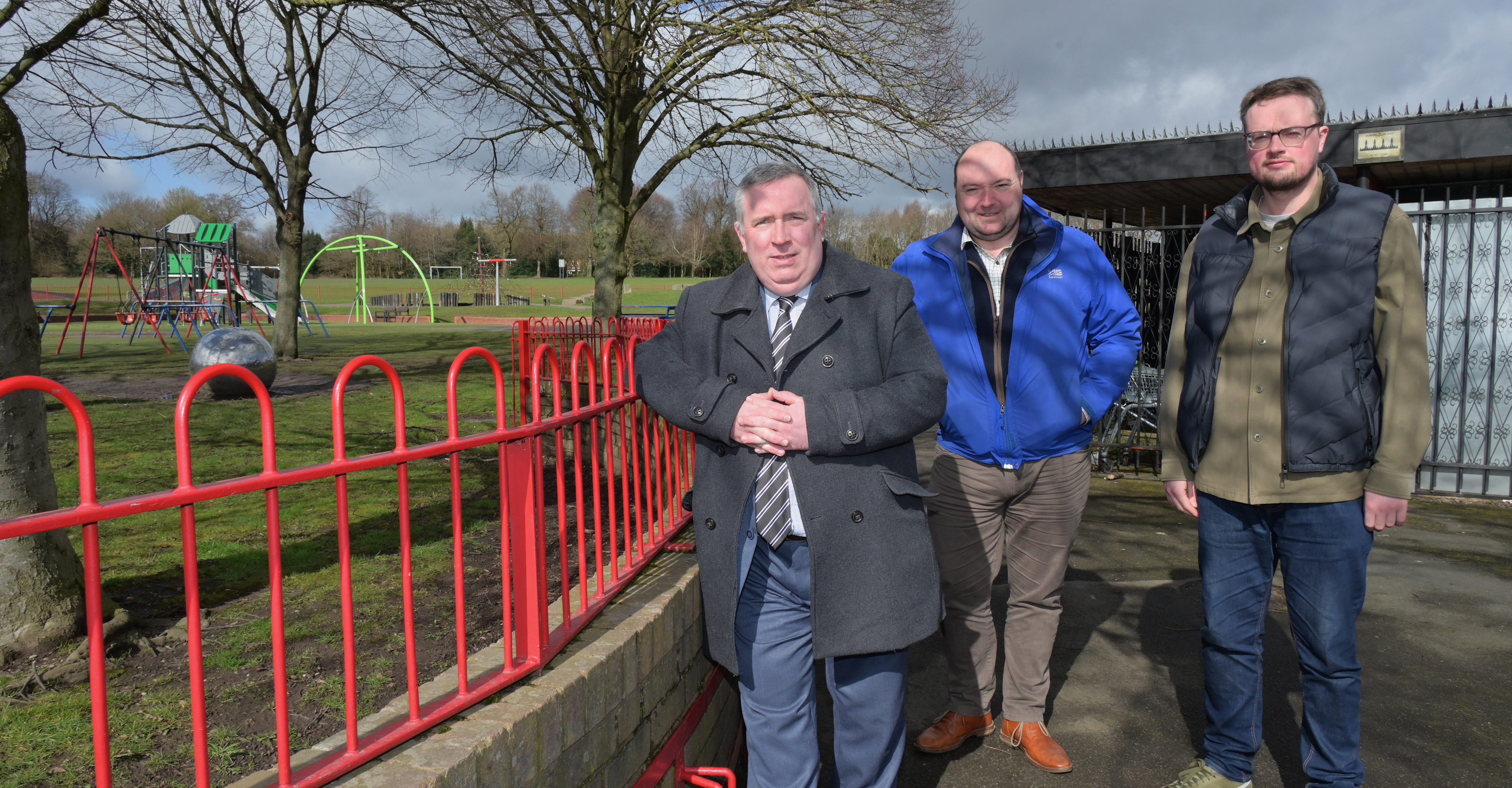 Councillor Andrew, Councillor Flint and Councillor Follows standing beside a children's park in King George V playing field Bloxwich