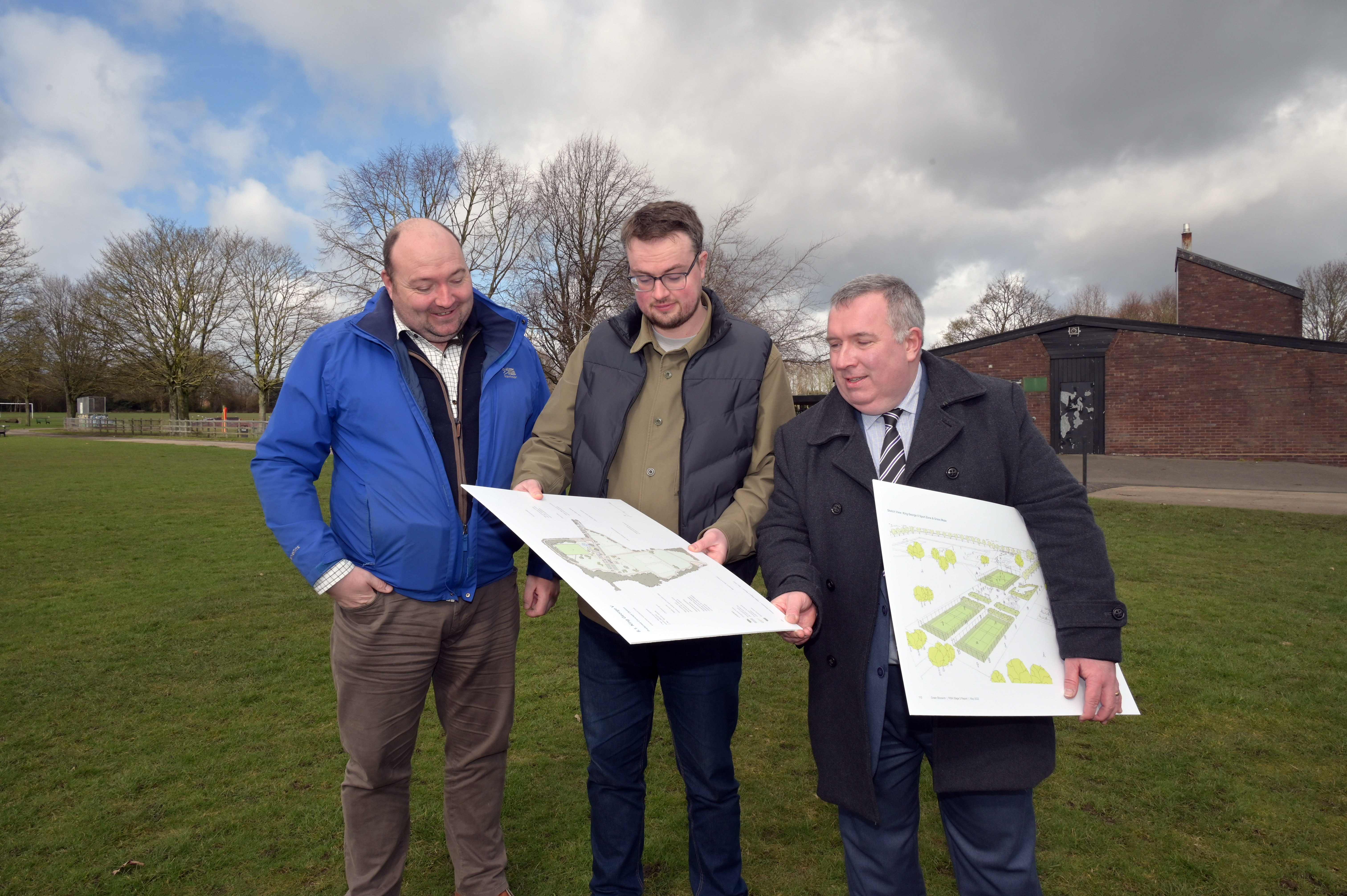 Councillor Gary Flint, Councillor Matt Follows and Councillor Adrian Andrew reviewing plans for King George V park standing on the playing field