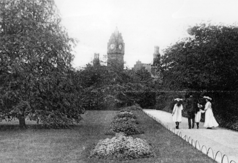 A family walking towards the Arboretum clock tower. Photo courtesy of Walsall Archives.