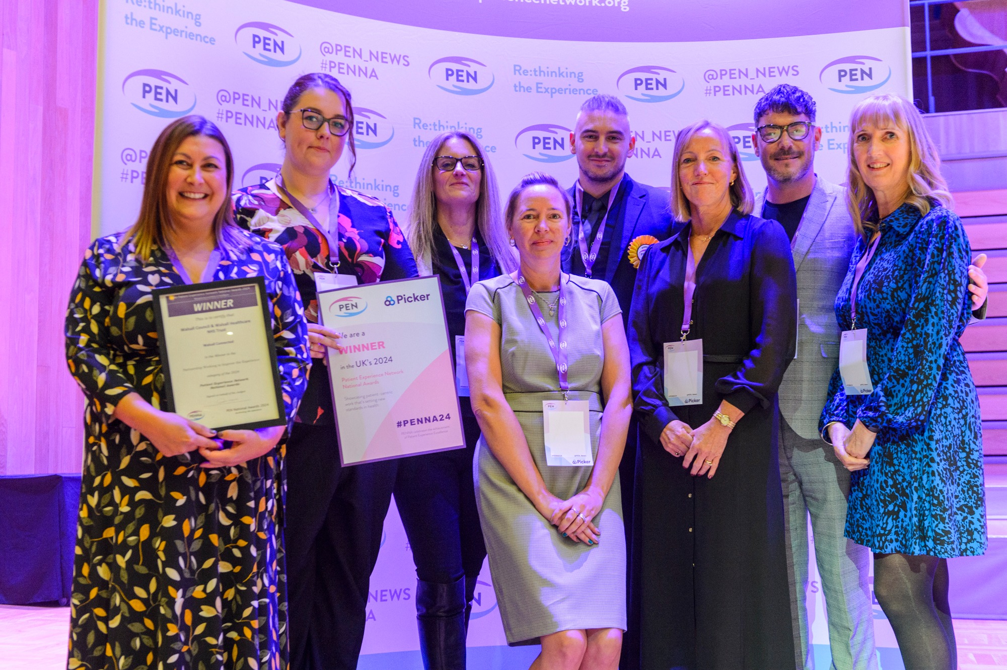 Group of Walsall Council and Walsall Healthcare Trust employees holding PENNA Award