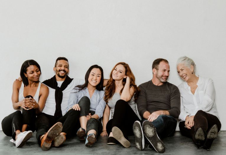 Image depicts a group of six diverse people. 