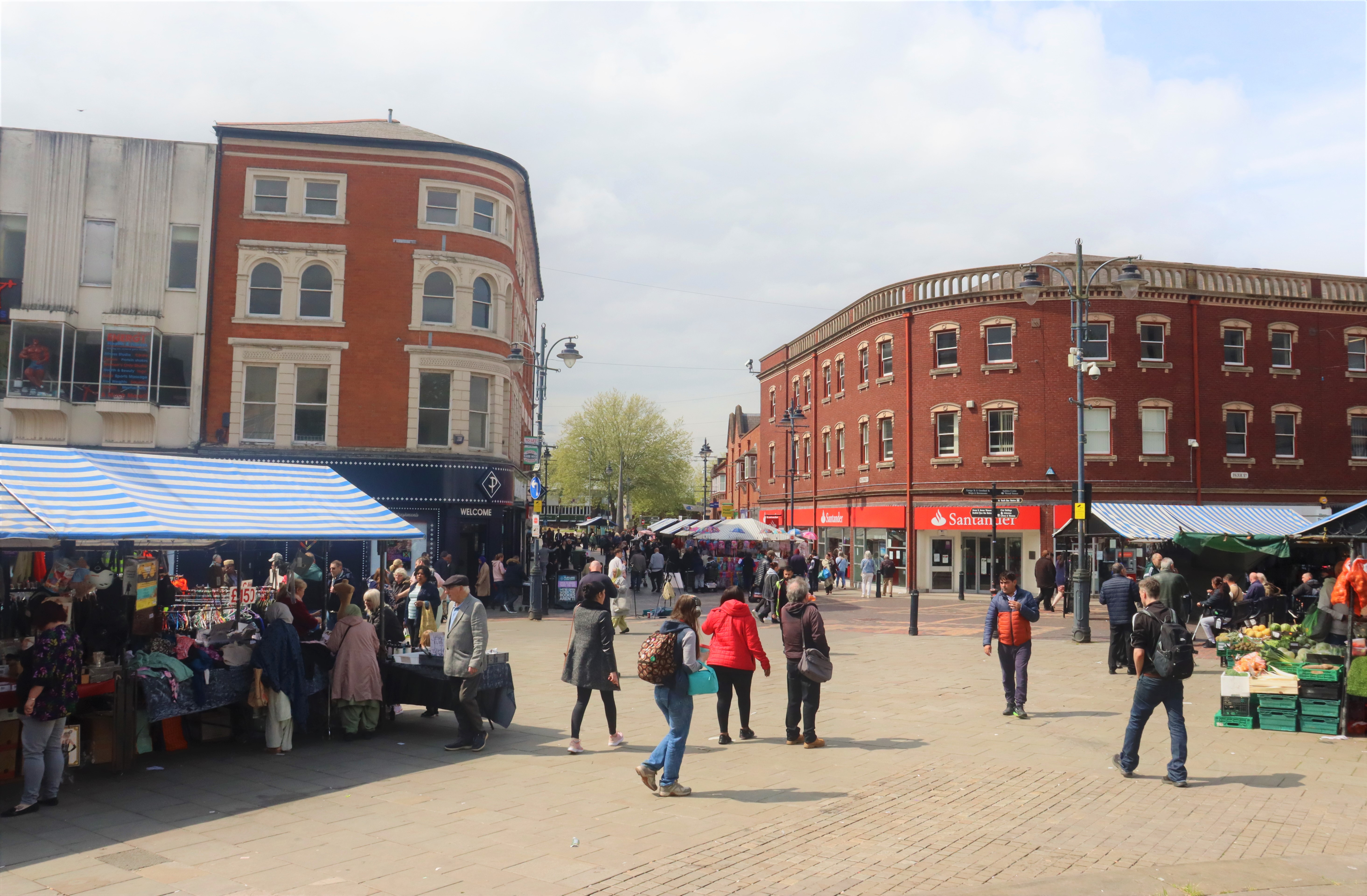 Walsall Continental Market stalls and people attending 