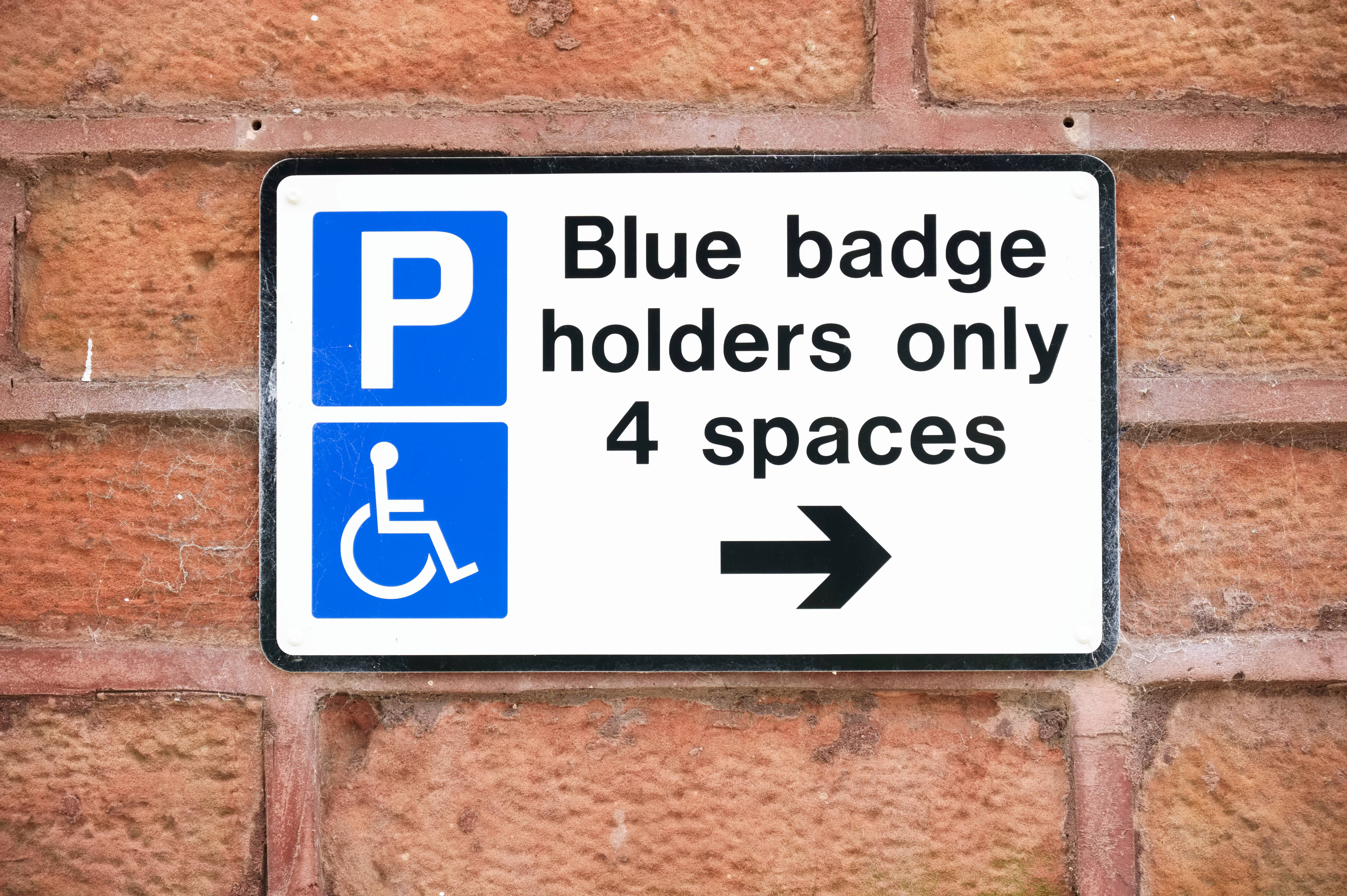 Blue badge holders only parking sign