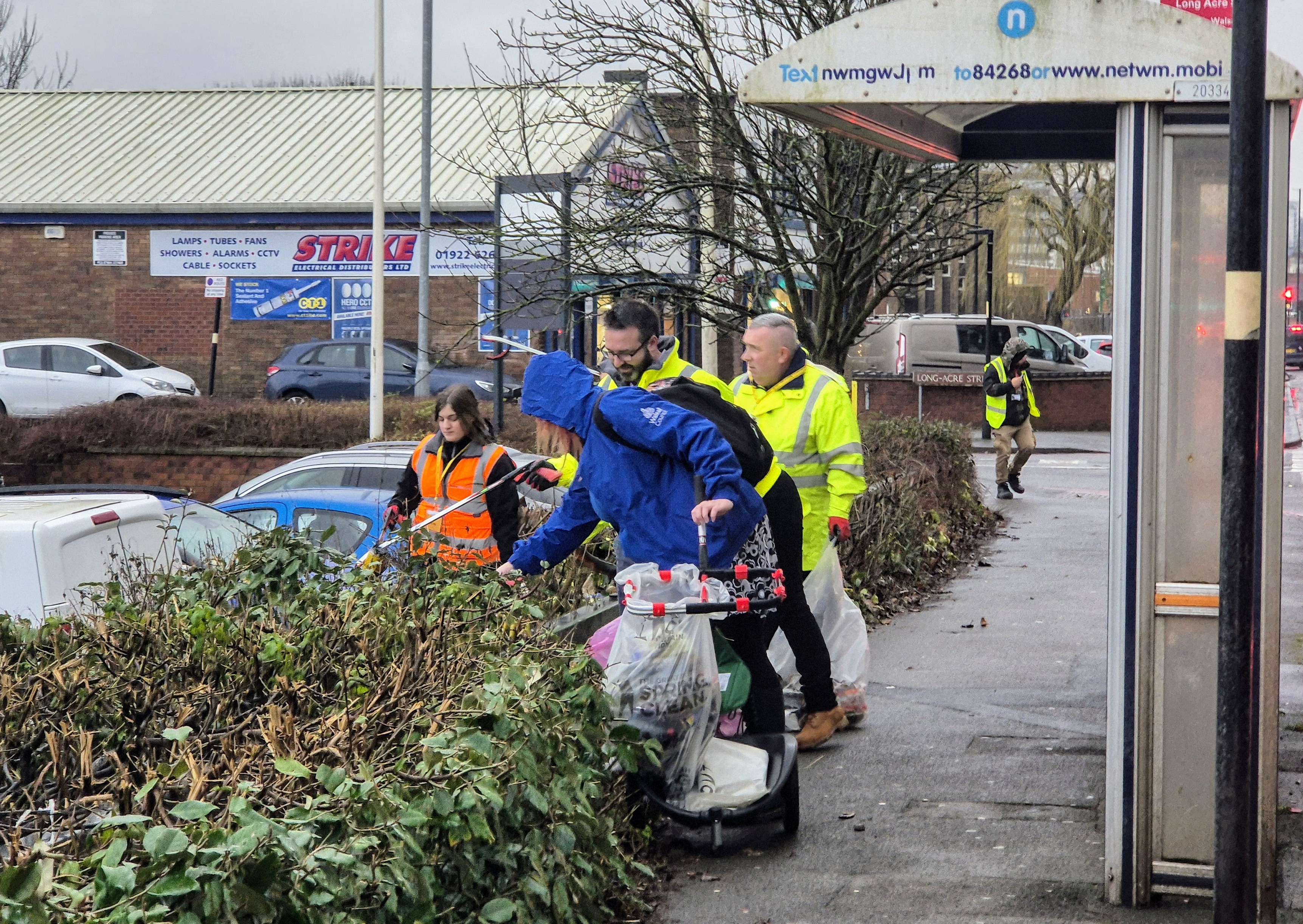 A group of people litter picking 