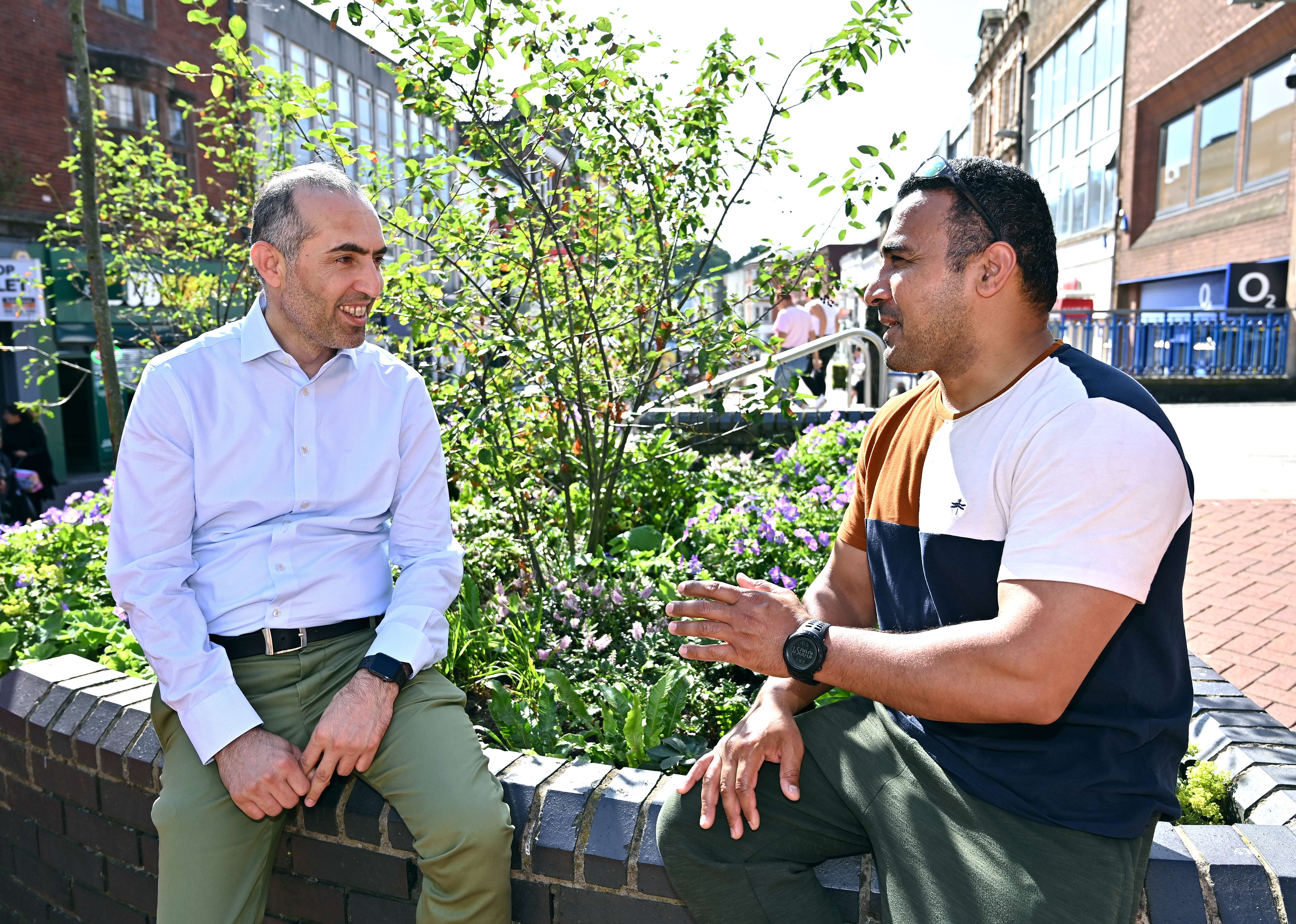 Two men talking in Walsall town centre