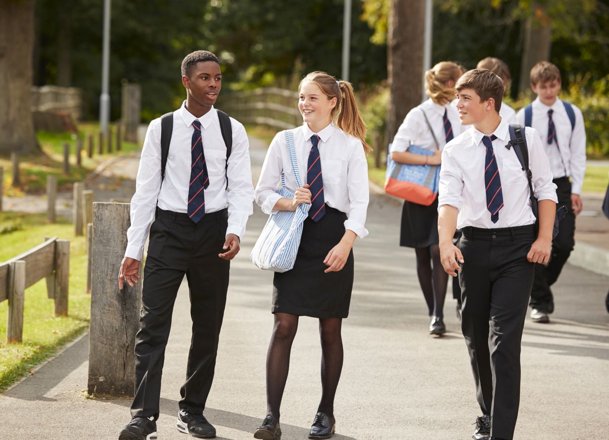 secondary school offer day - tree teenagers walking