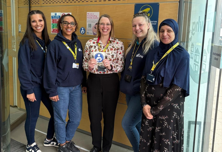 Image depicts five colleagues from whg promoting breastfeeding friendly at their headquarters in Walsall.