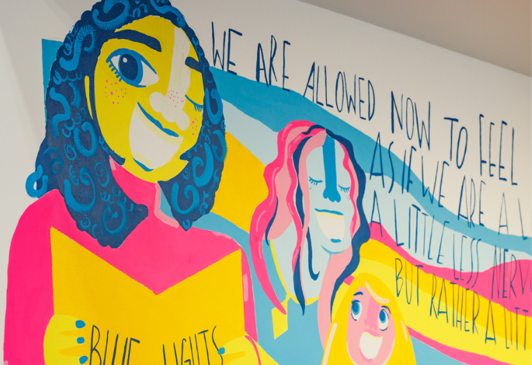 Colourful mural of the Blue Lights Choir at the Gallery