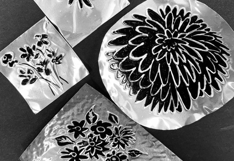 Flowers drawn on silver foil