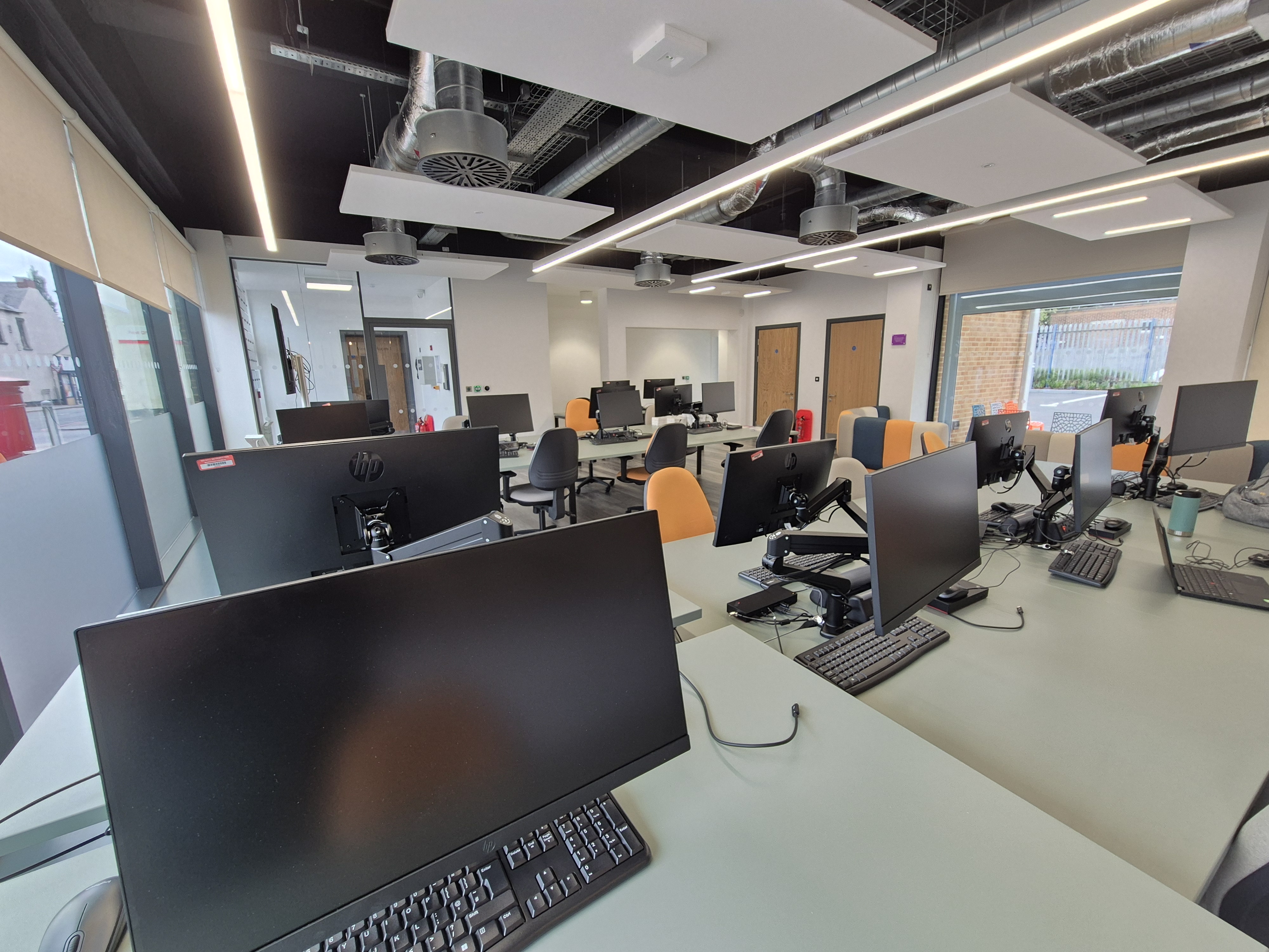 A bank of computers on desks