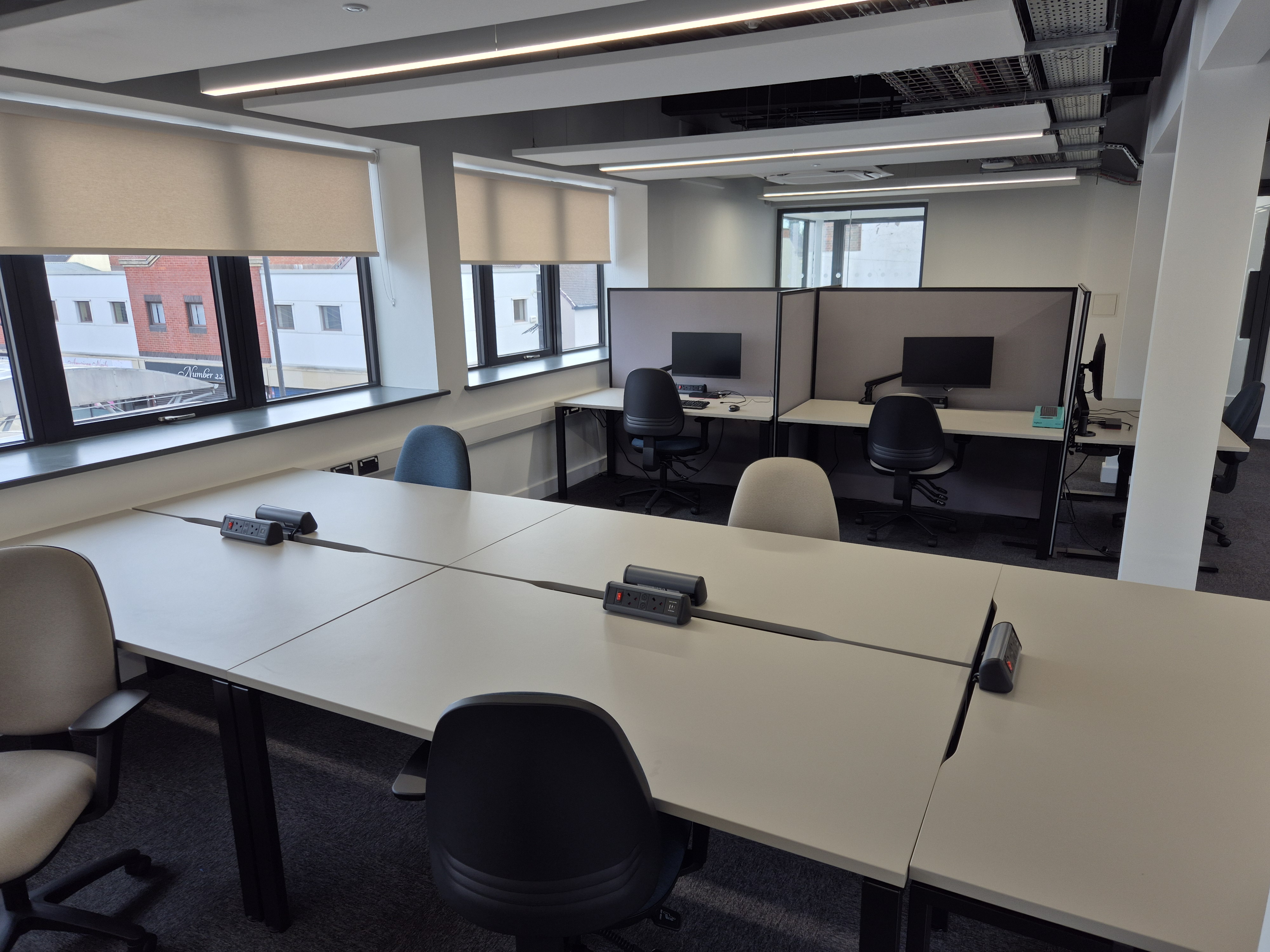 A set of desks in a new, vibrant coworking centre