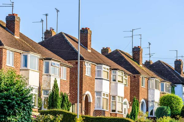 A row of terraced houses in the sun