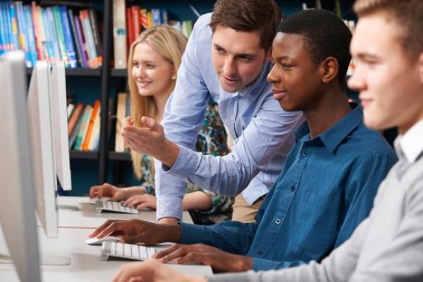 Group of adults looking at computer screens