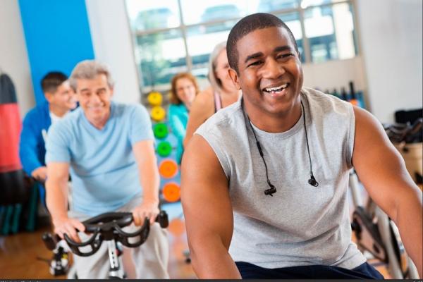 People using exercise bikes in a gym