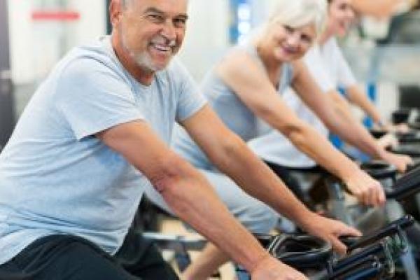 people on exercise bikes