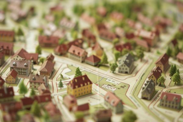 Model houses placed on a map in a town layout