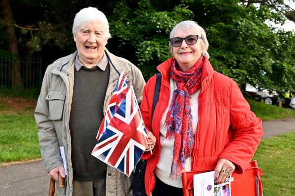 couple picture and they are both holding British flag