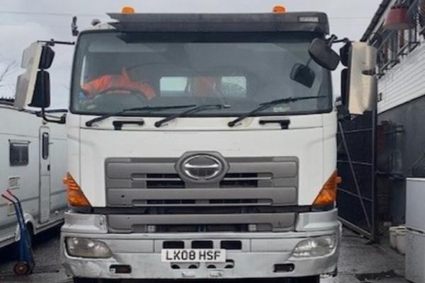 front of a white lorry