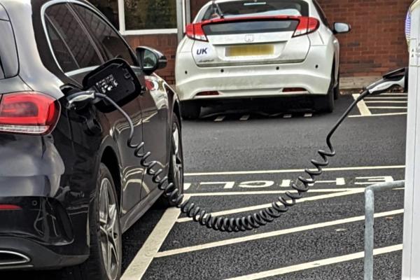 Electric car charge point - black car