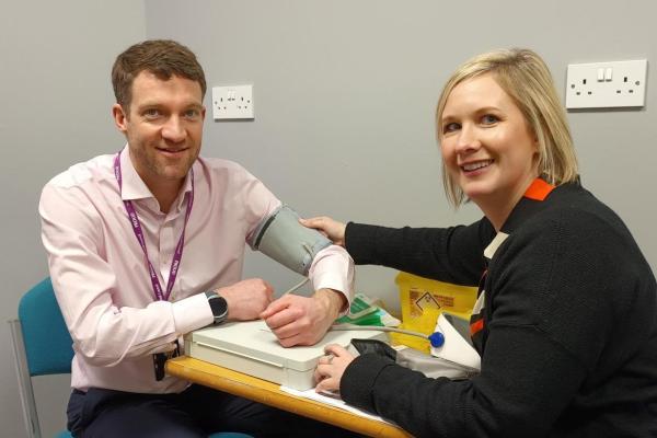Image shows Stephen Gunther, Director of Public Health having an NHS Health Check, undertaken by a specialist from One You Walsall.
