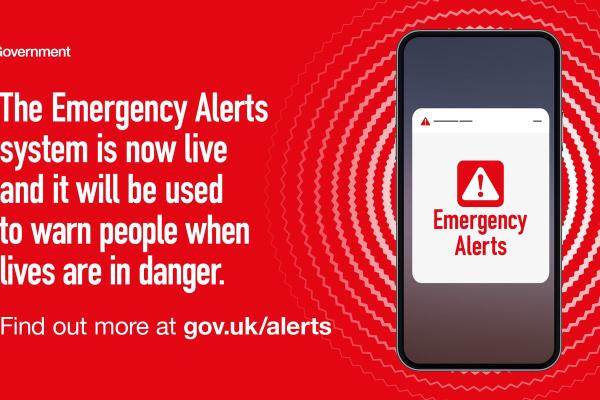 Red background showing a mobile phone that says emergency alerts in red text
