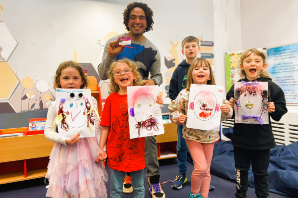 Joseph Coelho with (left to right) Irene Erin, Enid Wright, Ivy Chad, Blaire Gorman and William Chad at the Lichfield Street Hub Library, Walsall
