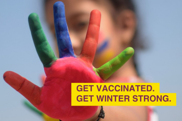 Image depicts a child holding a painted hand out. Text: Get vaccinated, get winter strong.