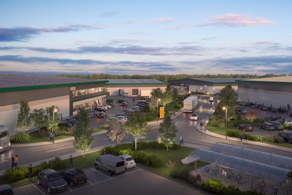 Artist's impression of the SPARK development, showing large industrial warehouses with people walking around at dusk, car parking and trees