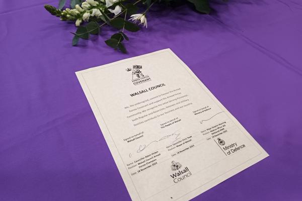 Image depicts a copy of the Walsall Council Armed Forces Covenant with three signatories.