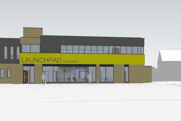 A computer generated image of a building, it's grey and sandy coloured with a green sign at the front that says Launchpad Bloxwich