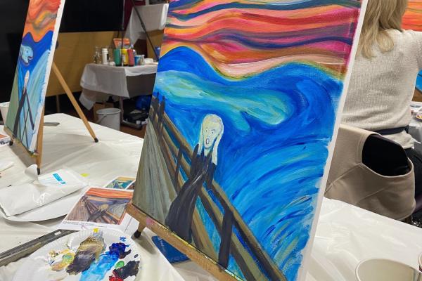 Versions of The Scream painted by workshop participants