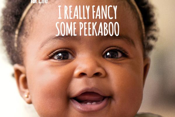 Image depicts a happy baby with the text 'I really fancy some peekaboo. Every moment together builds connections in their brain.'