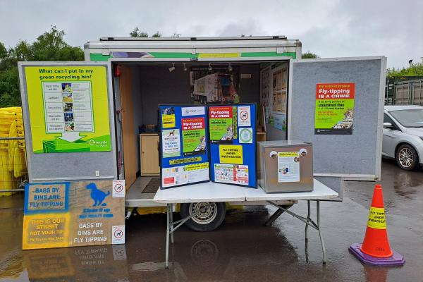 Image depicts a mock set-up of the EnviroCrime touring trailer.