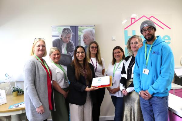 Walsall Connected Team holding cake