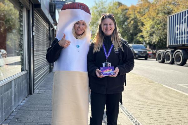 Image depicts members of Be Well Walsall, one of them in a cigarette costume in Bloxwich high street.