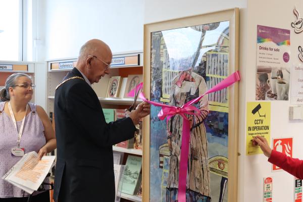 The Mayor of Walsall cutting the ribbon aroud the Sister Dora collage