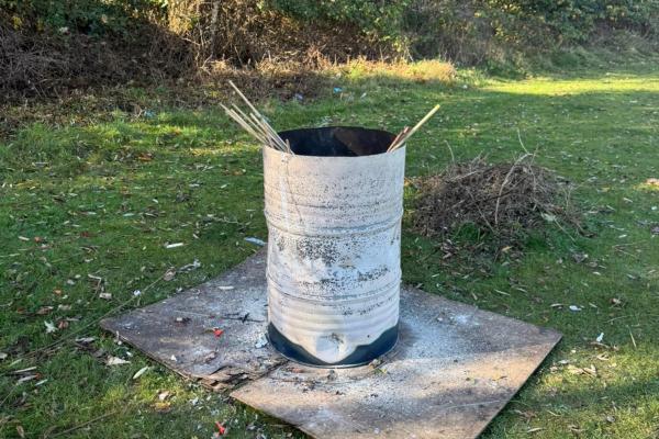 Image depicts a metal tin used for bonfire.